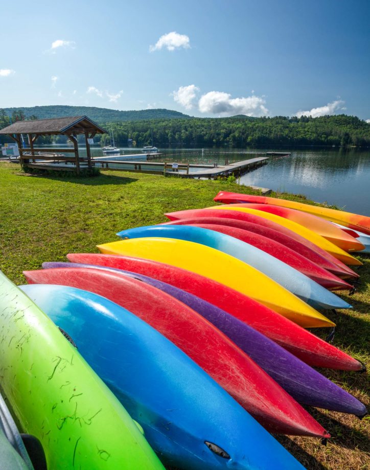Colorful kayaks lined up in a row.