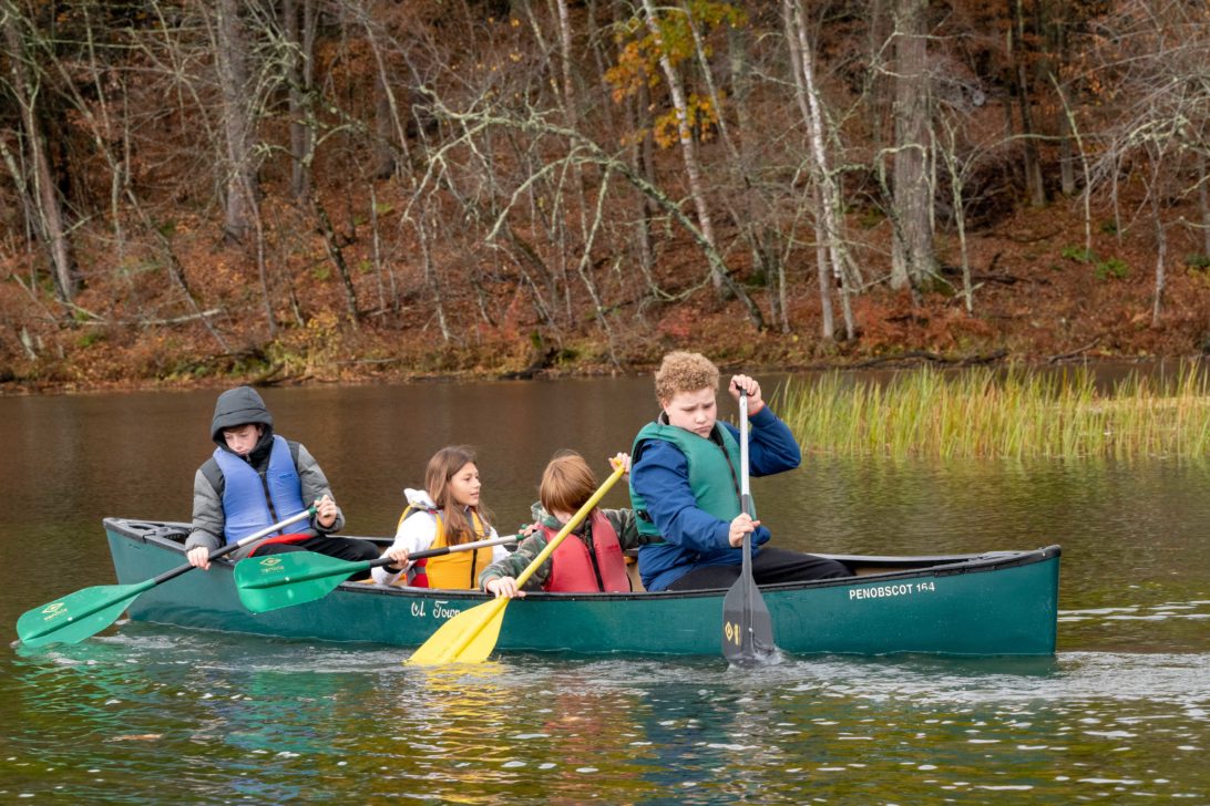 Four students canoeing at Hulbert.
