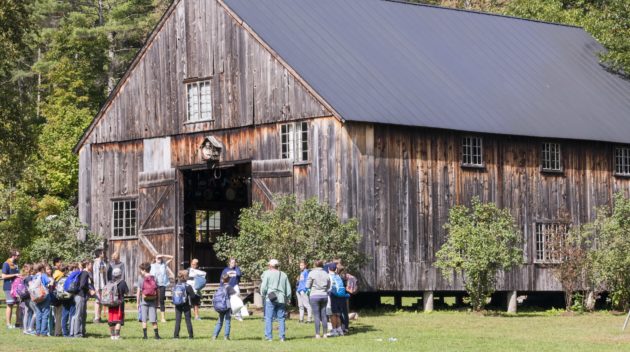 A Hulbert school group in a circle in front of the barn.
