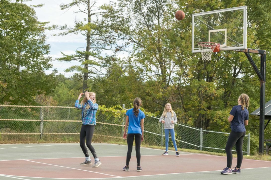 Four girls playing basketball.