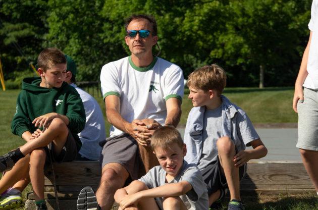Lanakila director Ridge sitting with a camper group.