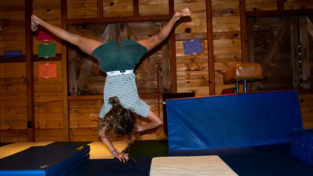 A camper learning gymnastics.