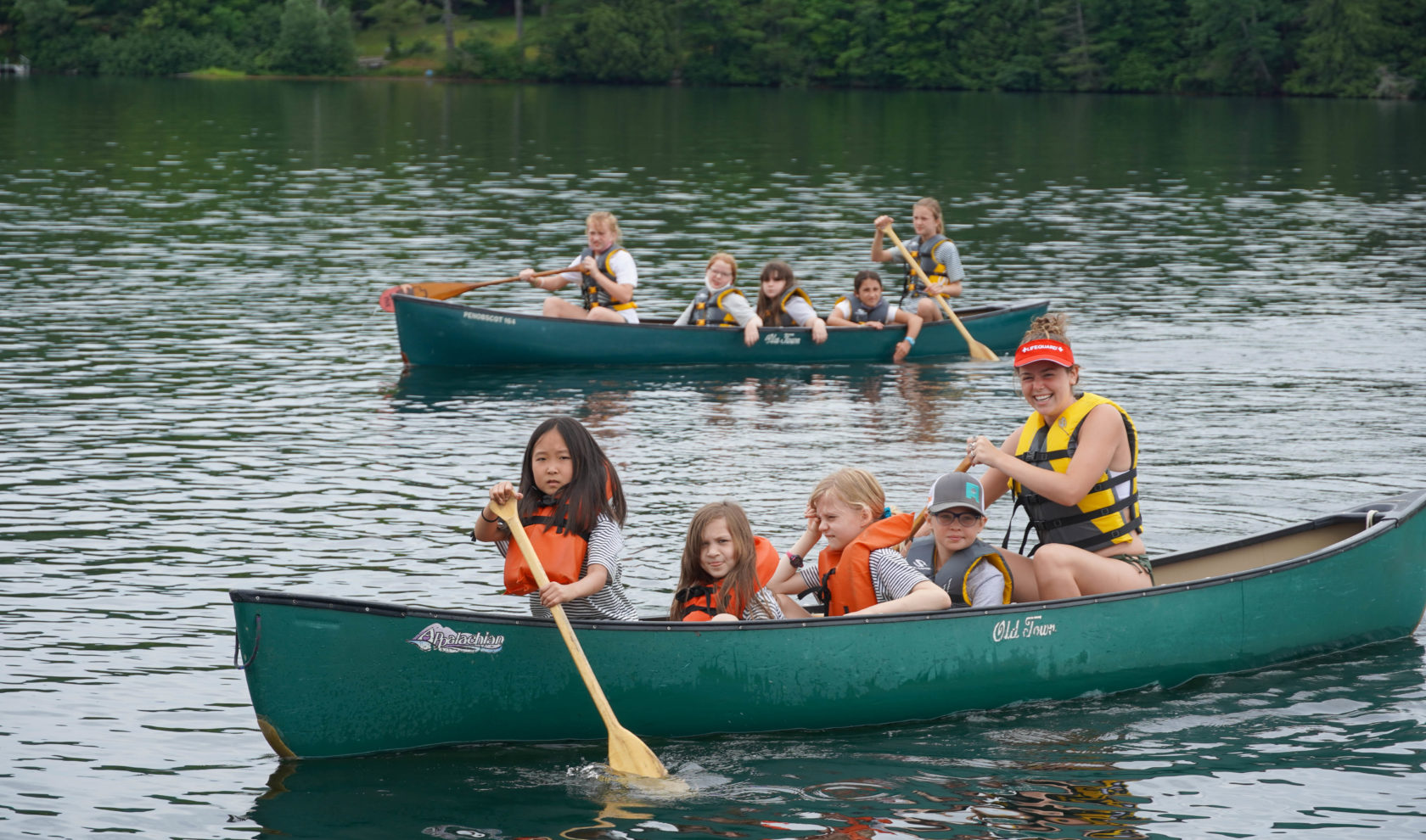 Campers learning how to canoe.