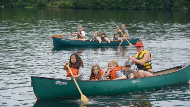 Campers learning how to canoe.