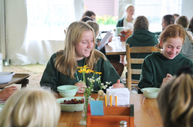 Campers eating together.