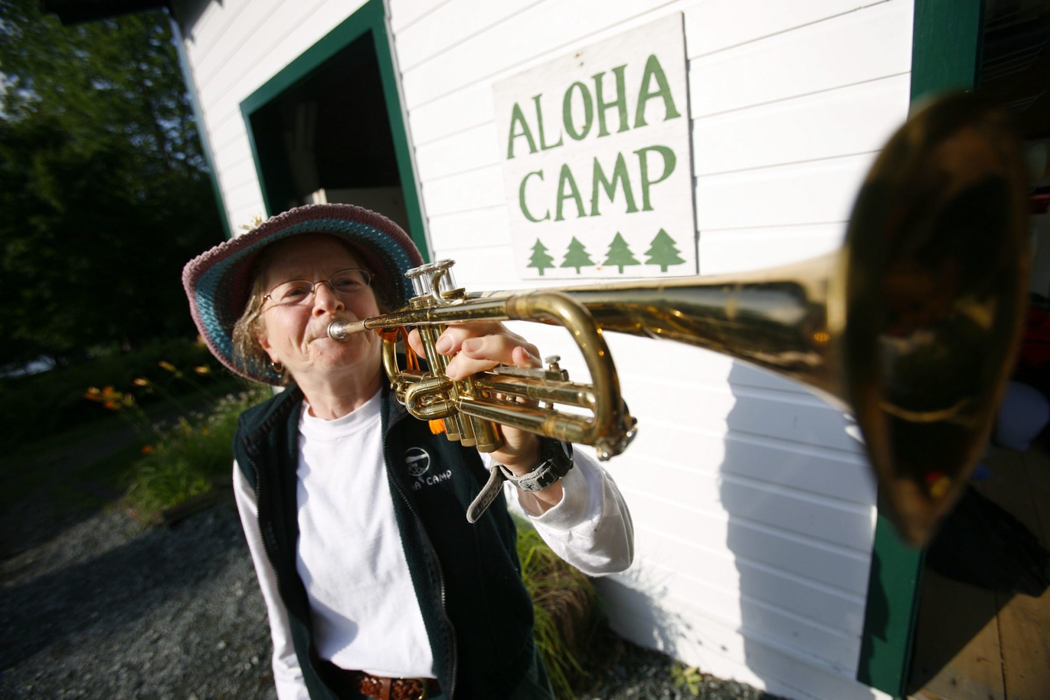 Aloha Staff Member Shel blowing the bugle.