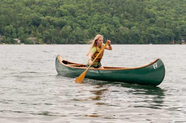 A camper canoeing.