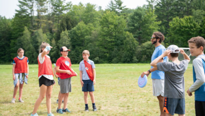 Campers playing ultimate frisbee.