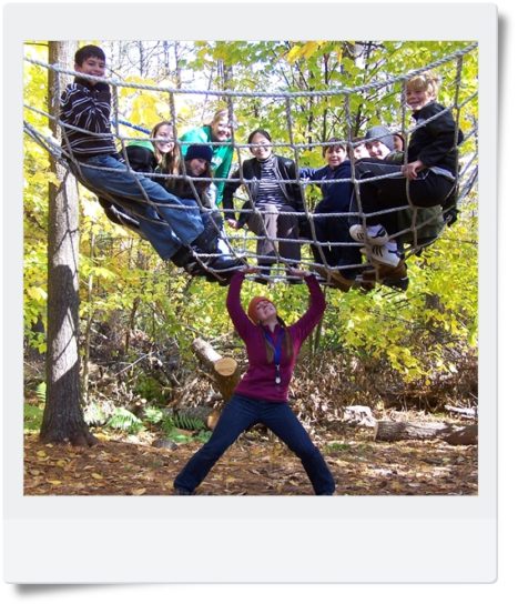 A group of Hulbert campers in a climbing net.