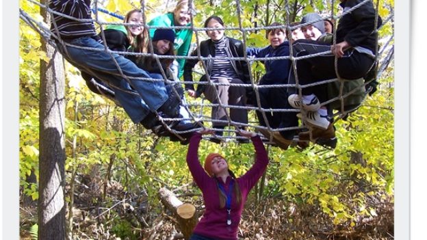 A group of Hulbert campers in a climbing net.