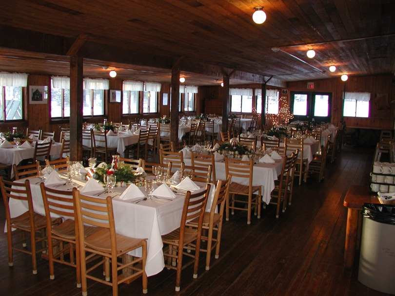 The Hulbert dining hall with tables set for a wedding.