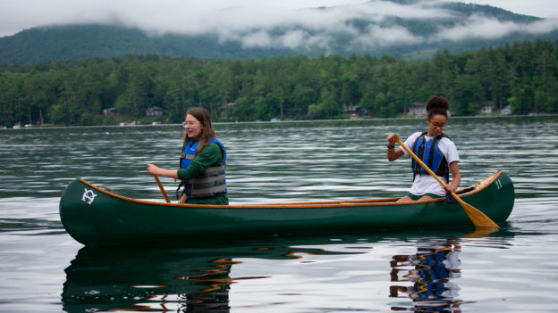 Two campers canoeing.