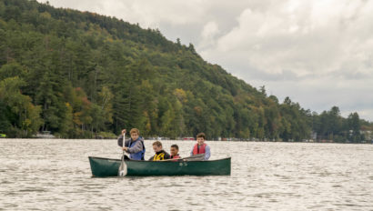 Members of a Hulbert school group in a canoe on the lake.