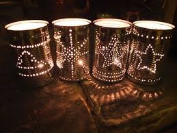 A tin jars illuminated from the inside with holes punched to form a constellations.