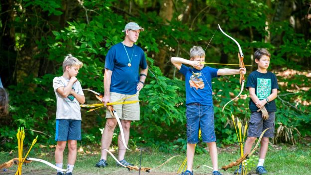 Campers learning archery.