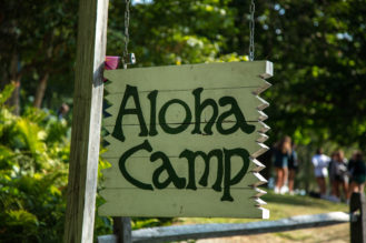 A sign that reads, "Aloha Camp".