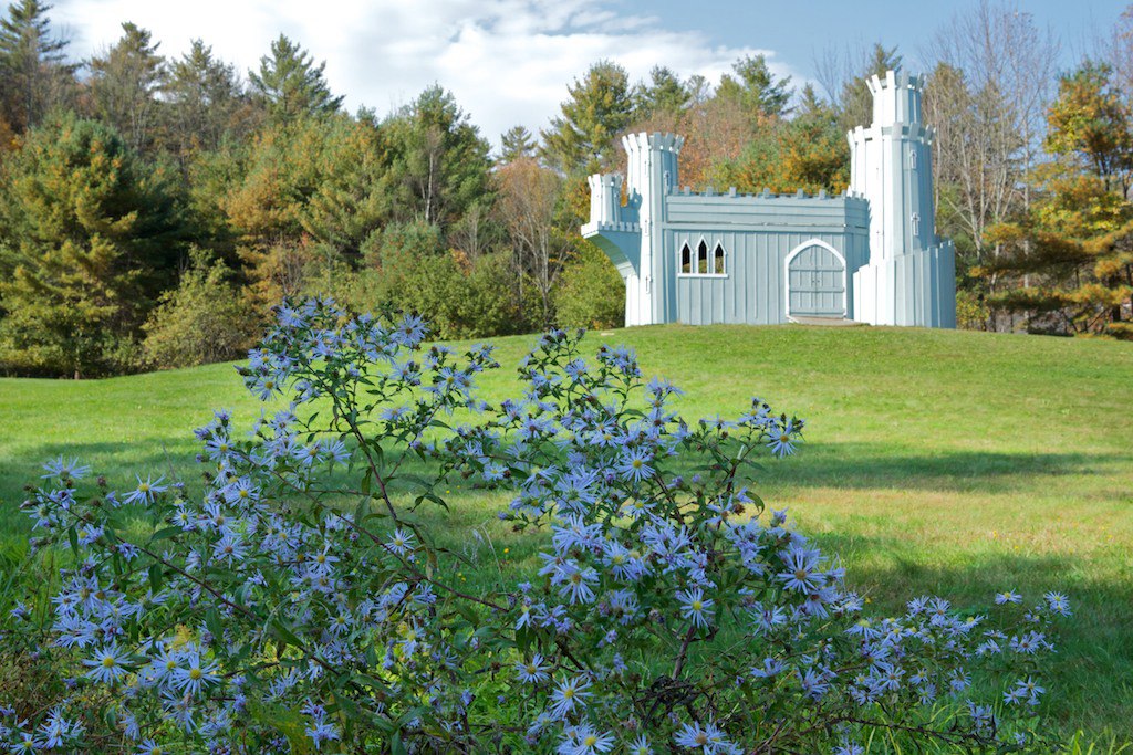 Flowers in front of Lanakila's blue wooden castle.