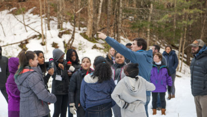 A instructor leading a team building activity during the winter.
