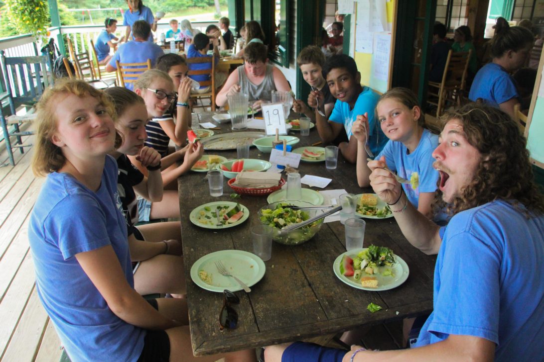 A group of campers having lunch together.