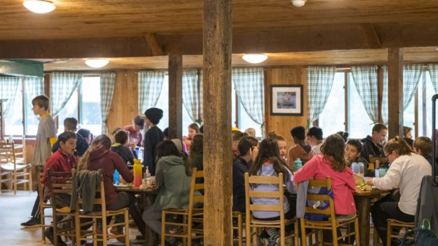 The Hulbert dining hall full of participants eating a meal.