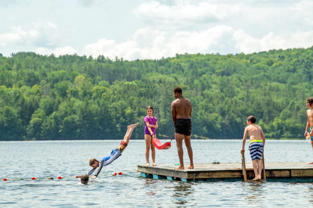 Campers diving off the dock at Horizons.