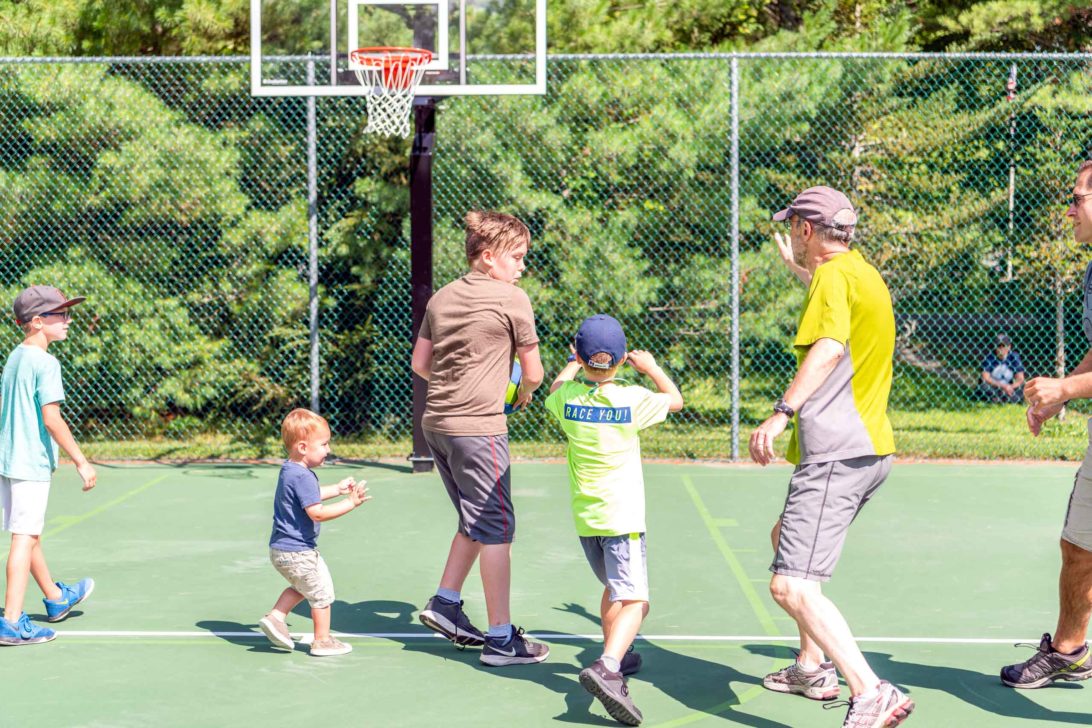 A family playing basketball together.